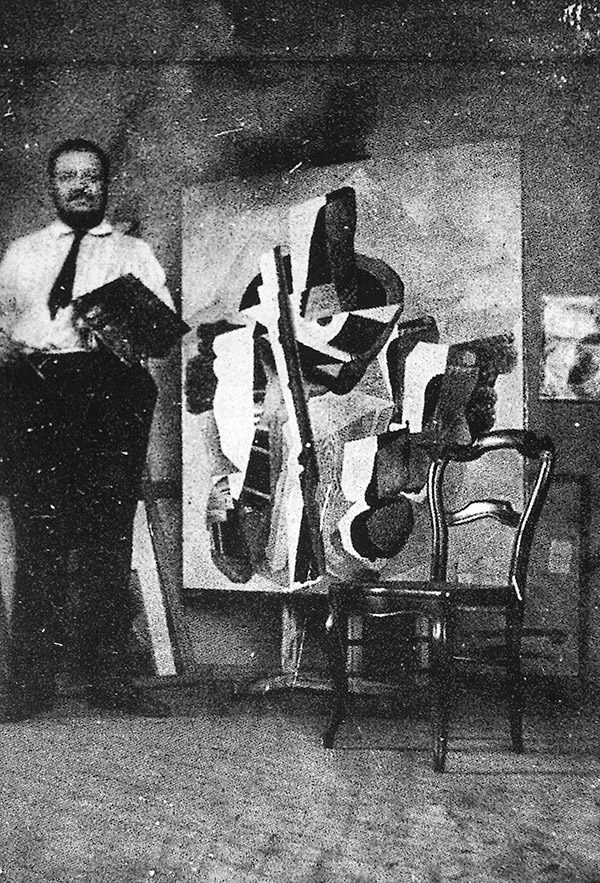 Diego Rivera dans son atelier devant le tableau Zapatista Landscape.
